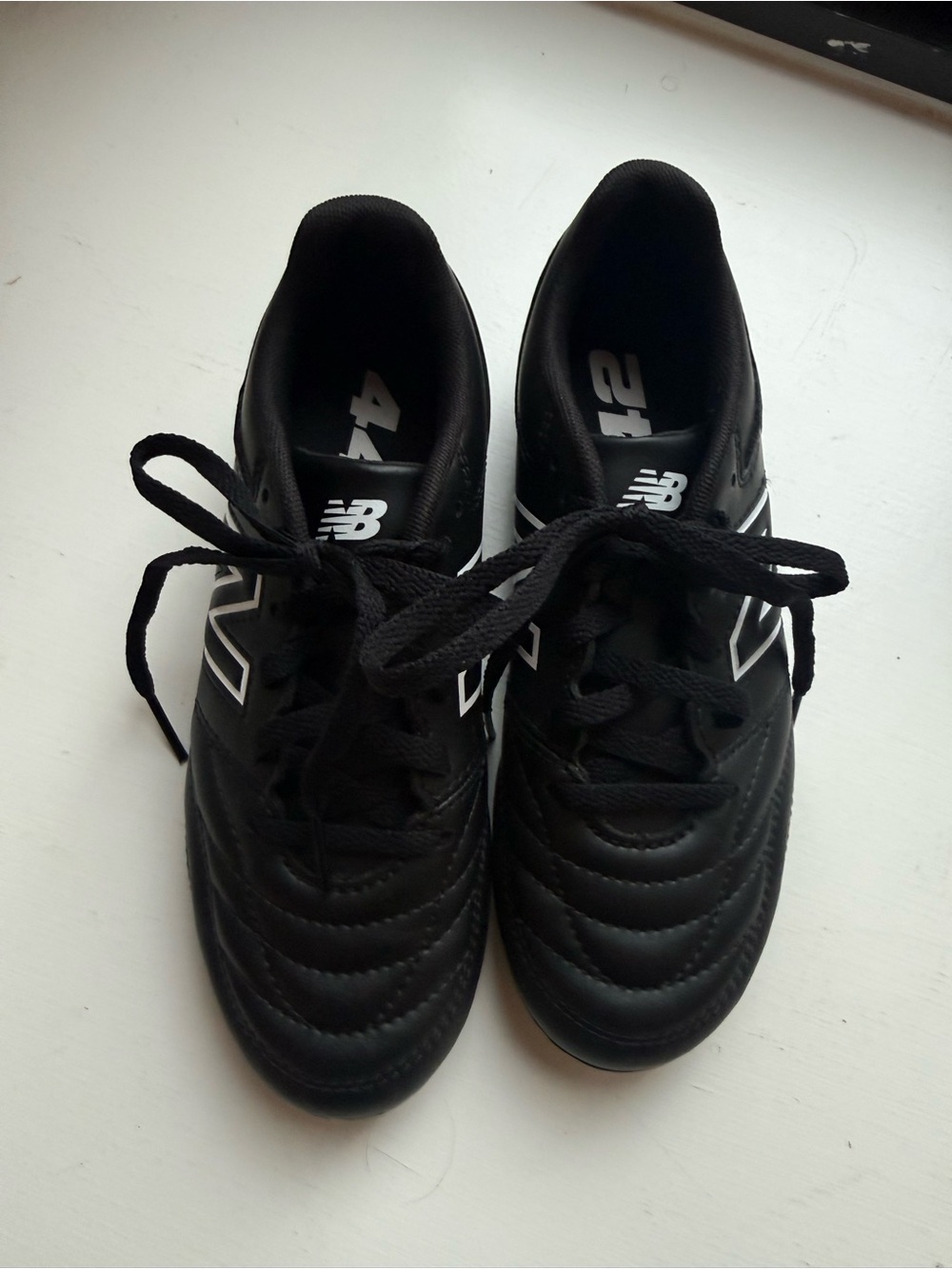 New Balance Boys Black Cleats with White Accents